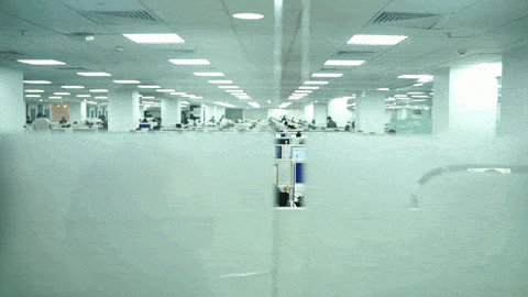 AM InfoWeb office workspace with teams working across a modern operations floor, highlighting scale and organized service delivery.